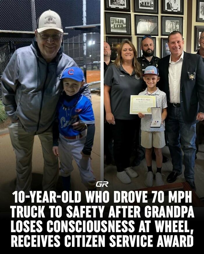 Young boy in a baseball uniform receives a Citizen Service Award with a group in a formal setting.