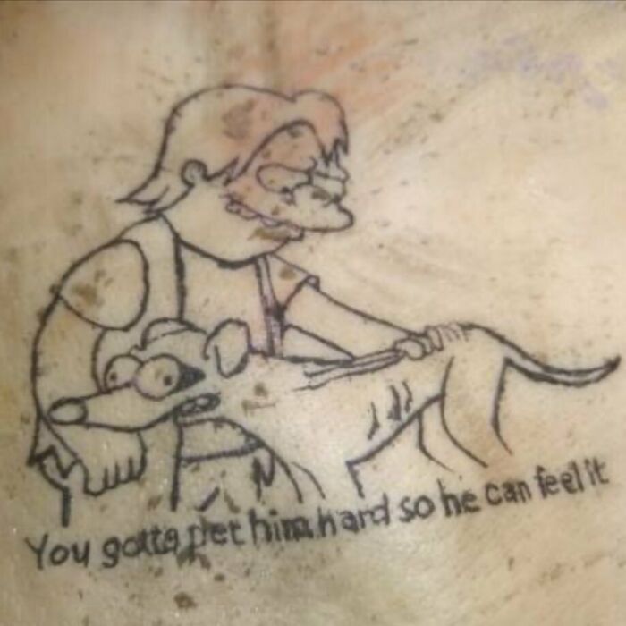 Horrible Simpsons tattoo of a character petting a dog with a humorous caption.
