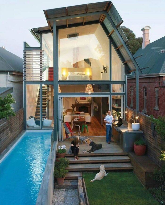 Modern tiny home with glass walls, outdoor pool, and garden showcasing clever off the grid living design ideas.
