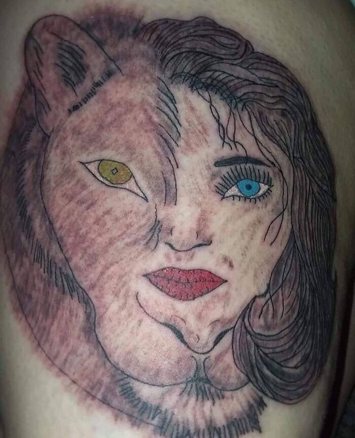 Bizarre tattoo blending a cat and woman's face, showcasing permanent mistakes people inked on their bodies.