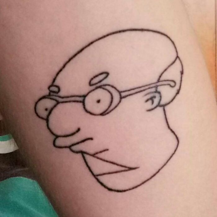 Minimalist tattoo of a character from The Simpsons with glasses and a peculiar expression.