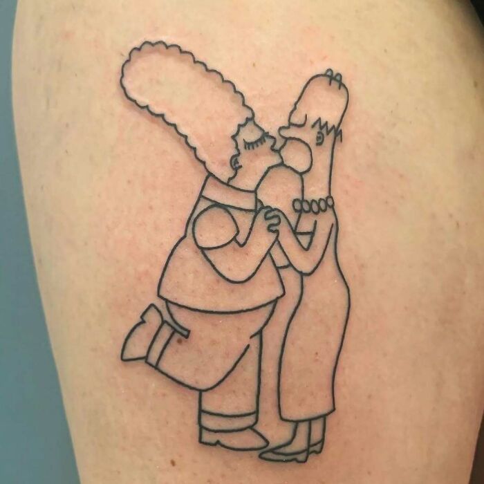 Line art Simpsons tattoo of Marge and Homer kissing on skin.