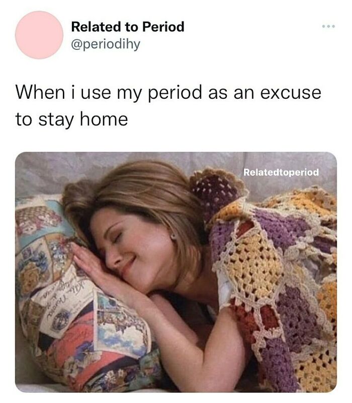 Woman smiling, wrapped in a colorful crochet blanket, lying on a pillow. Period memes caption about using an excuse to stay home.