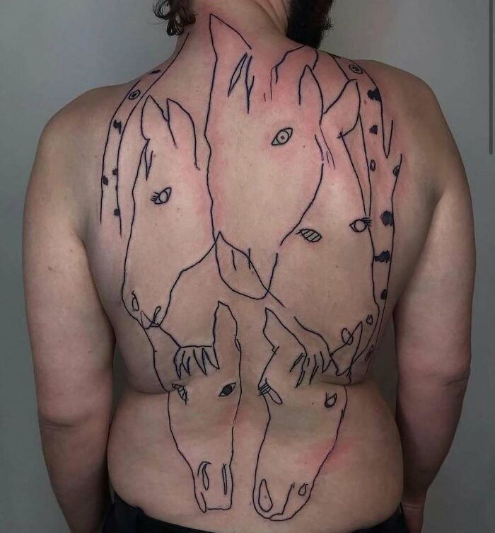 Back tattoo featuring abstract horse outlines, showcasing permanent ink mistakes.
