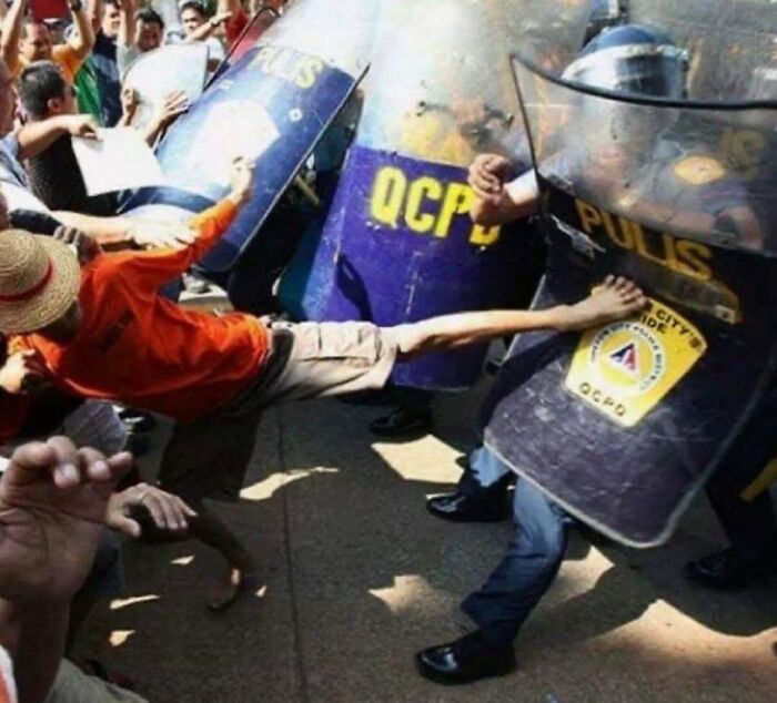 Protester kicks police shield during intense demonstration, showcasing one of the hardest posts from IG.