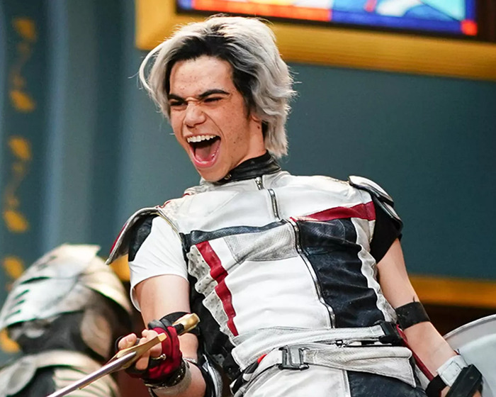 Young actor in costume, energetically performing, illustrating the vibrancy of child actors lost too soon.