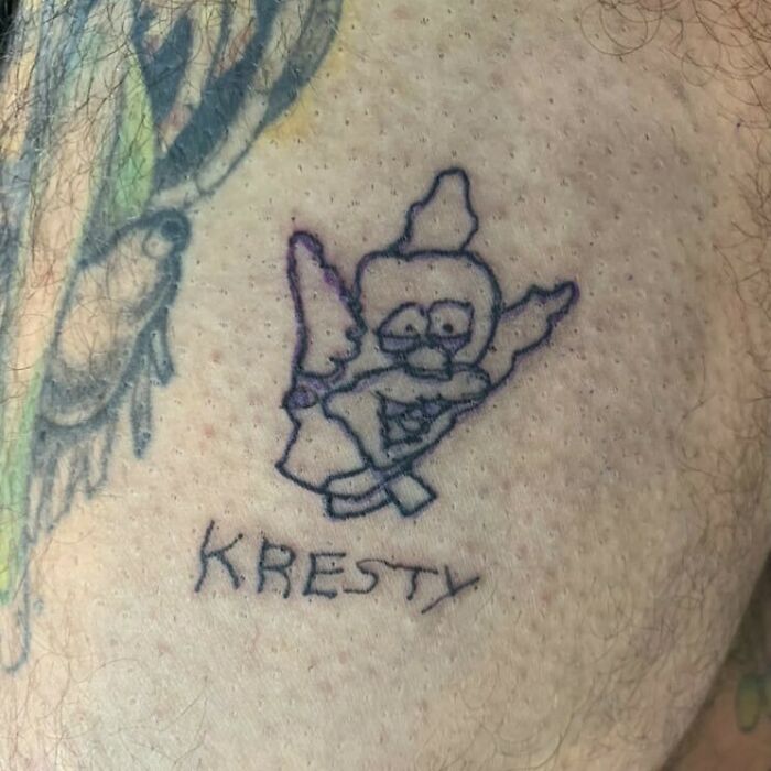 Unusual Simpsons tattoo depicting a crude drawing of a character labeled "Kresty."