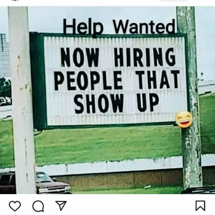 Sign reads "Help Wanted: Now Hiring People That Show Up" with a laughing emoji. Funny and relatable work meme.