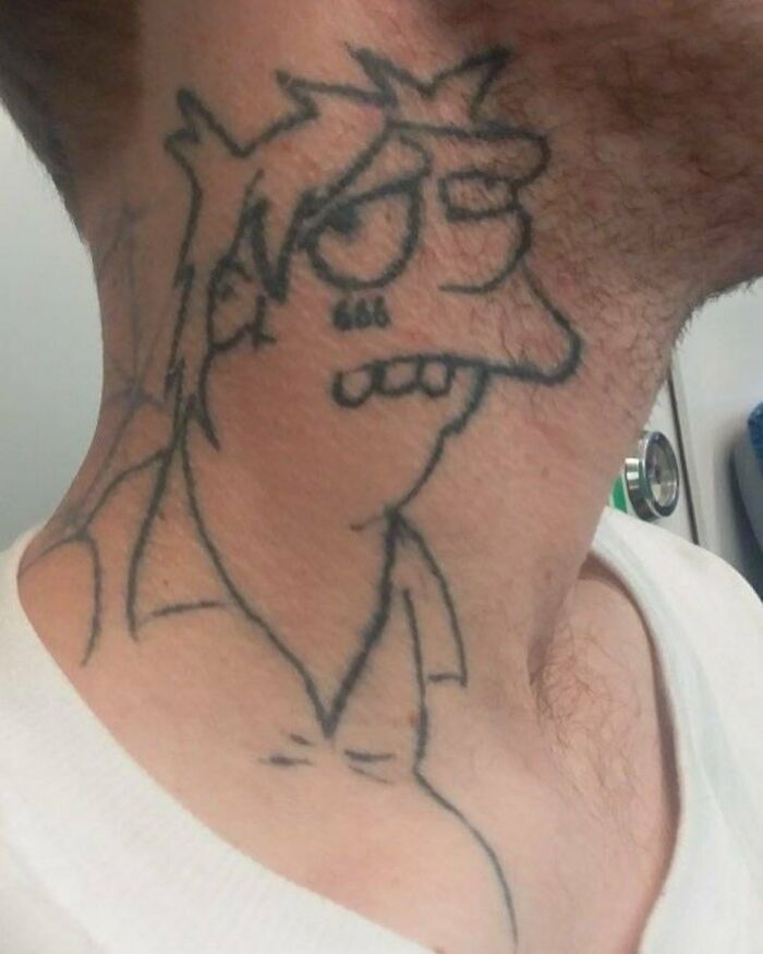 Tattoo of a Simpsons character on a person's neck, showcasing a unique and unusual design style.