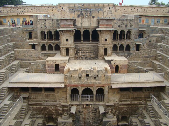 Ancient architectural wonder featuring intricate stone carvings and deep stepwell structure.