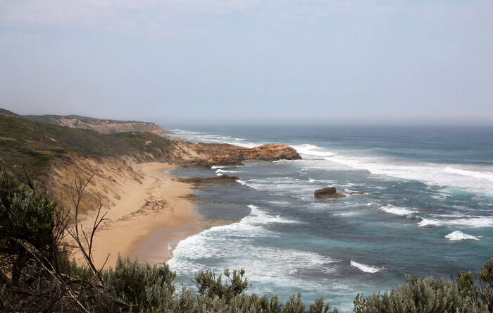 Coastal landscape with cliffs and ocean waves, a historical natural scene.
