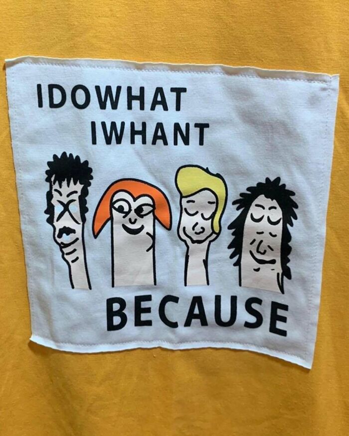 T-shirt with humorous typo reading "Idowhat Iwhant Because" and cartoon faces, illustrating translation mishaps.