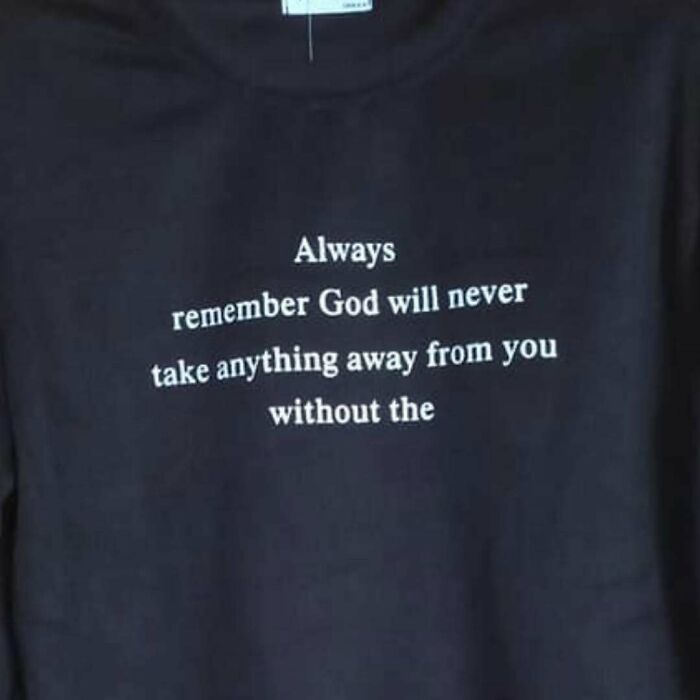 Black T-shirt with humorous lost in translation quote about God, missing the last part of the phrase, printed in white text.