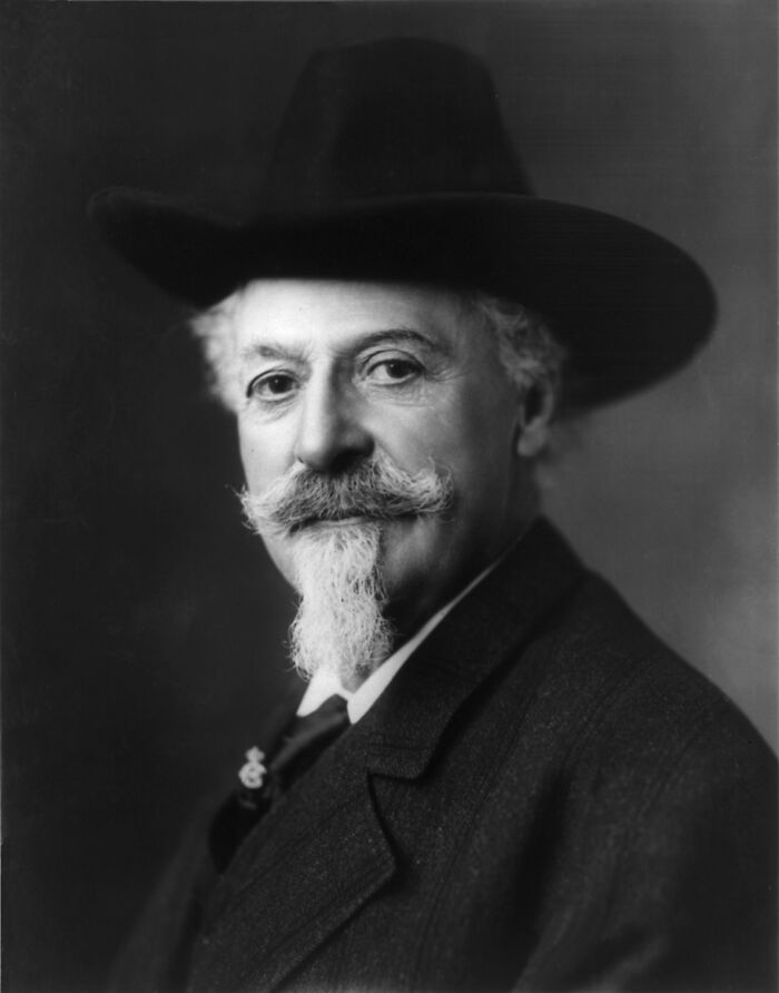 Black and white portrait of a famous historical figure with a prominent mustache and beard wearing a wide-brimmed hat