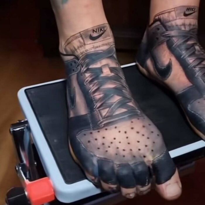 Sneaker tattoo on feet resembling a permanent mistake, with detailed Nike design.