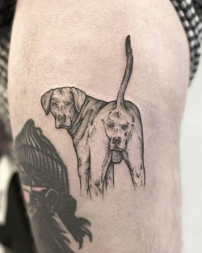 Humorous tattoo fail featuring a dog's hindquarters, illustrating bad body art decisions.
