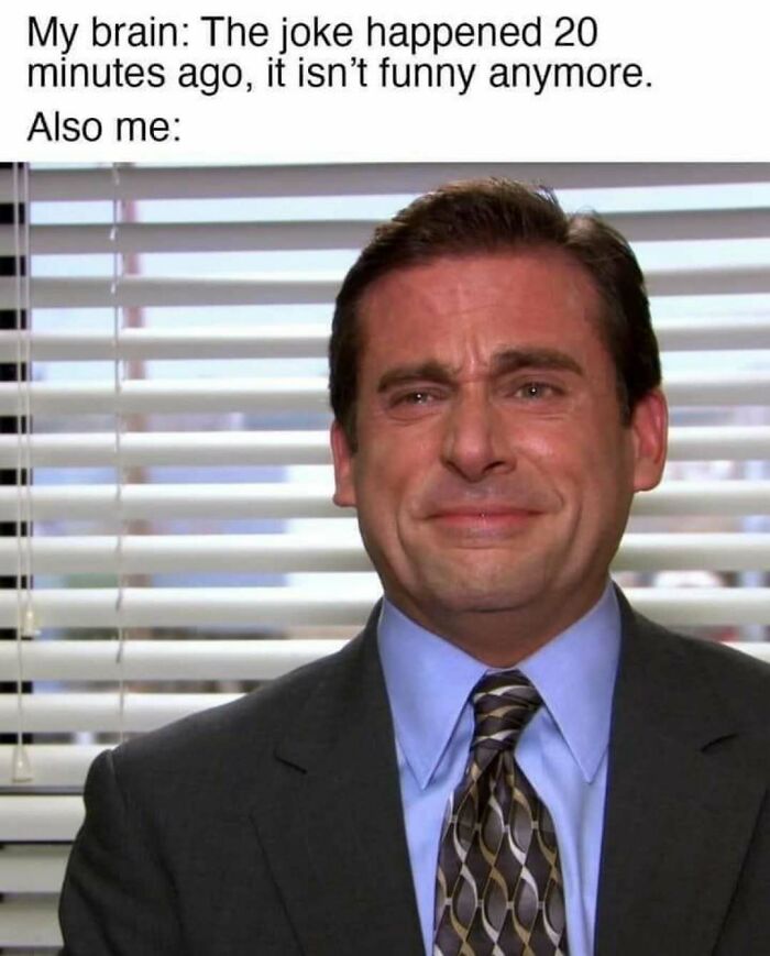 Man from 'The Office' smiling painfully at a joke, showcasing one of the best memes from the show.