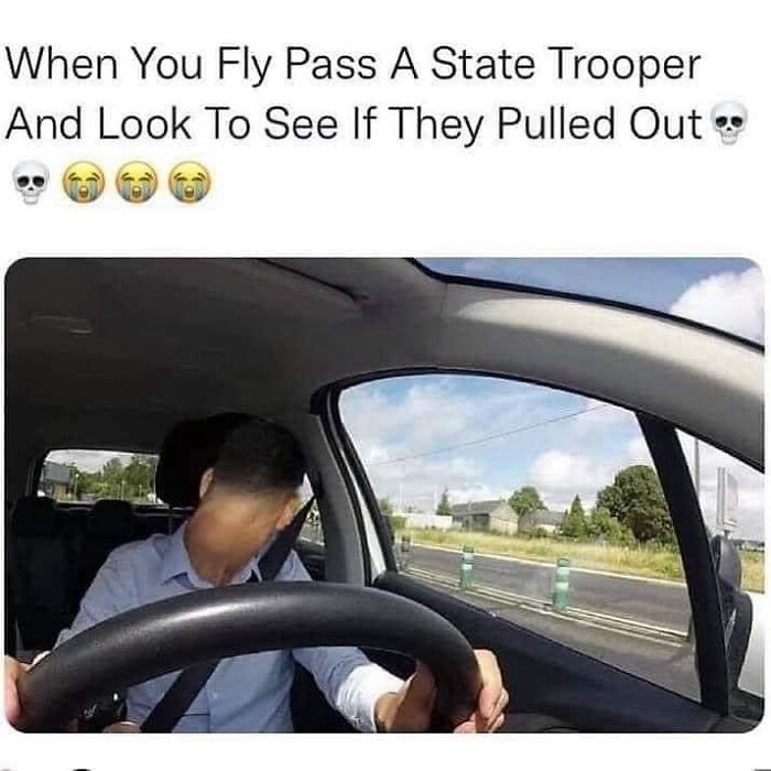 Man in car looking behind nervously after passing a trooper, capturing car meme humor.