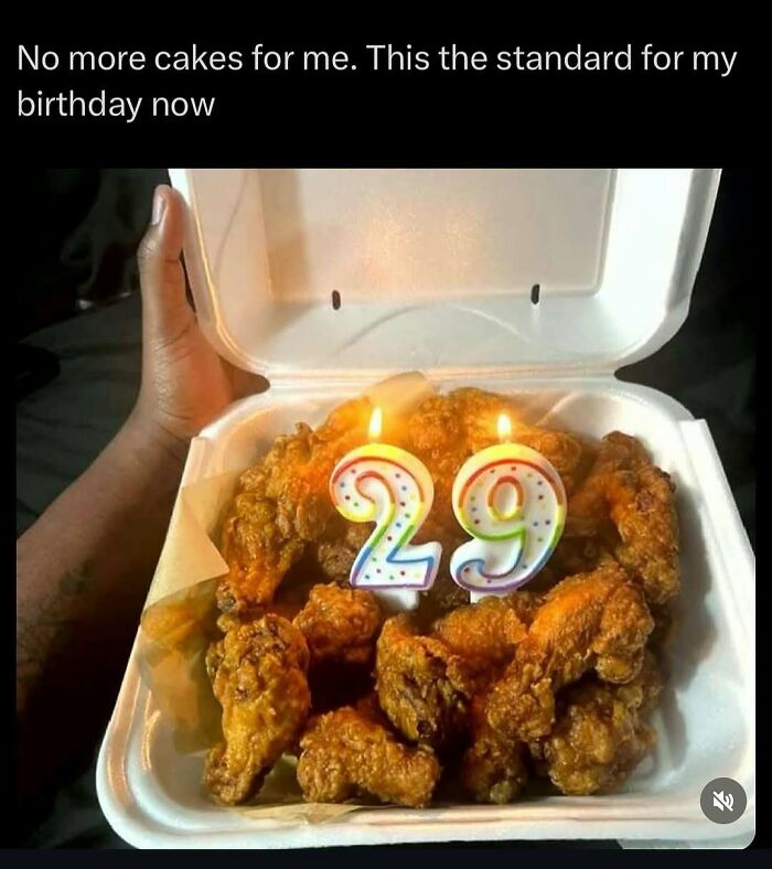 Takeout box of chicken wings with "29" candles for a funny meme birthday celebration.