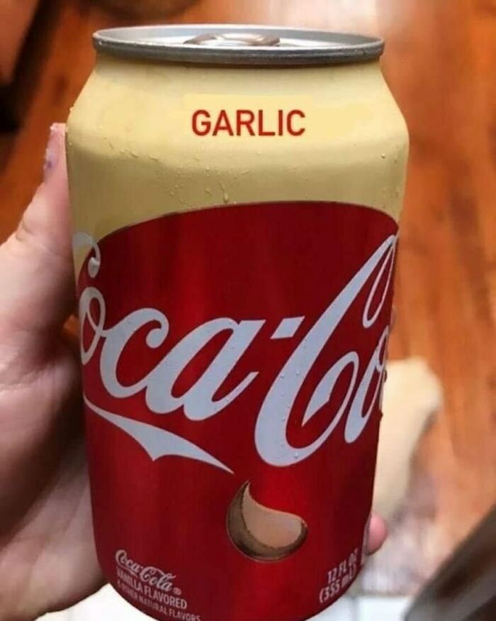 Garlic-flavored Coca-Cola can being held, showcasing a humorous and unusual product label.