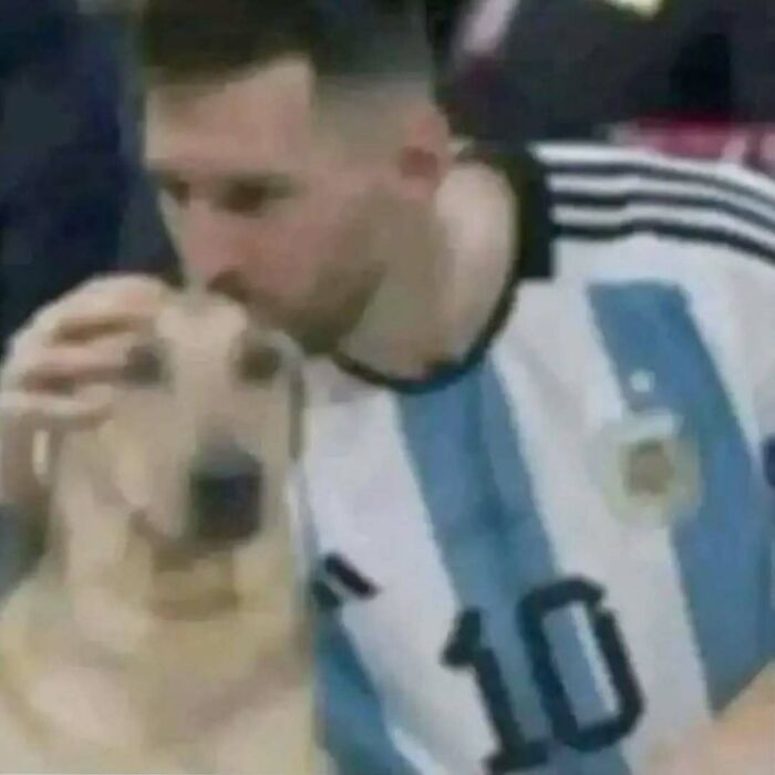 Soccer player in Argentina jersey pats a dog, capturing a humorous moment from IG's hardest posts.