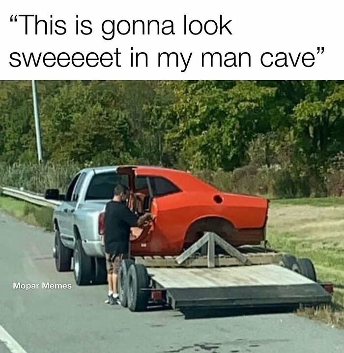 Man loading half a car onto a trailer, creating a humorous car meme moment.