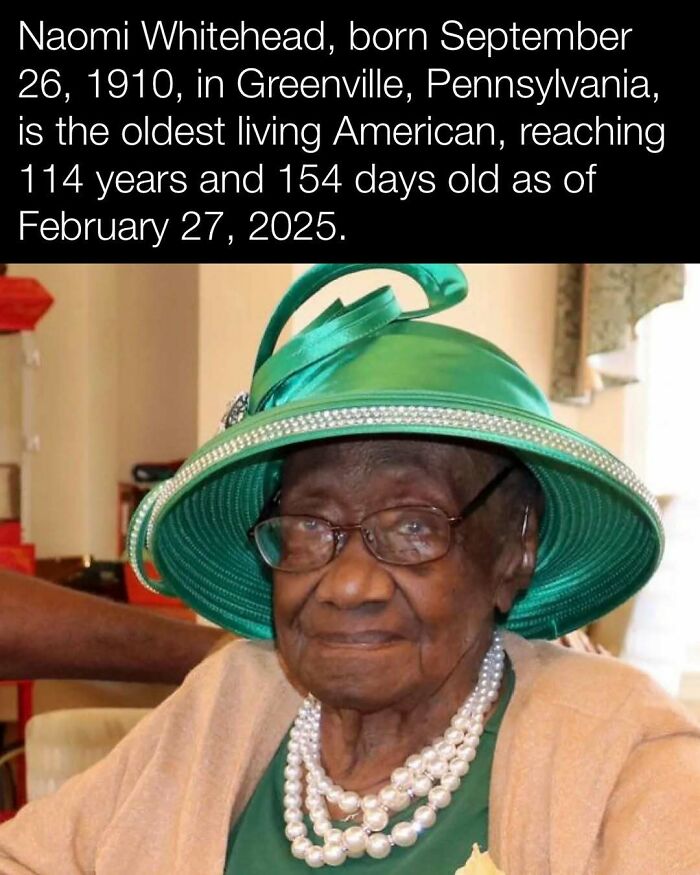 Elderly woman in a green hat and glasses, representing interesting history from the U.S., wearing a necklace and cardigan.