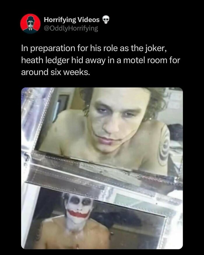 Man looks at his reflection, face painted as a disturbing character, an unnerving scene from a preparation period.