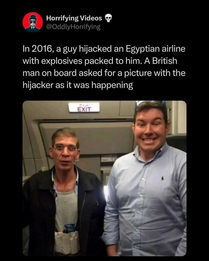 Two men on an airplane, one looking tense, the other smiling. The unnerving image captures an oddly horrifying moment.