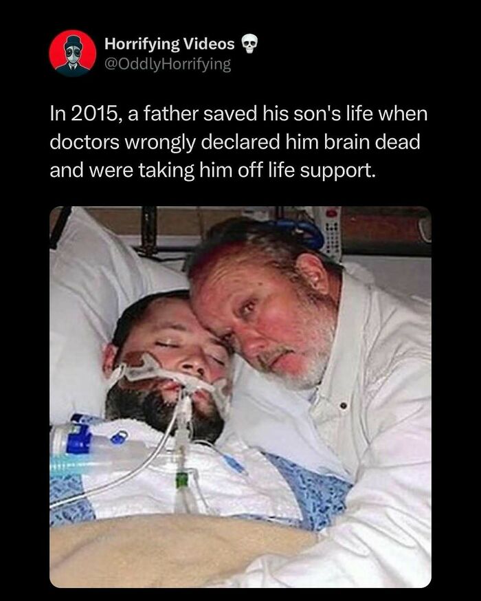 Father embraces son in a hospital bed, saved from being wrongly declared brain dead, creating an unnerving scene.