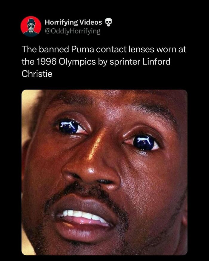 Close-up of eyes with unnerving Puma logo contact lenses, emphasizing the oddly horrifying appearance.