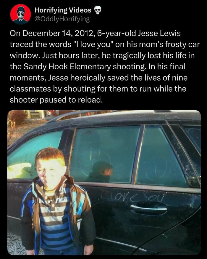 A child stands next to a car with "I love you" traced on the frosty window, evoking oddly horrifying emotions.