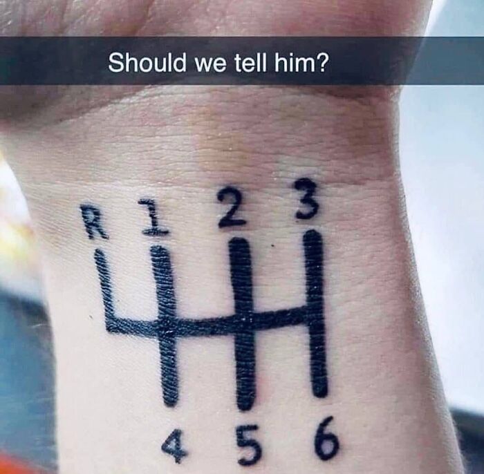 Tattoo of car gear shift pattern on forearm with humorous caption, related to car memes.
