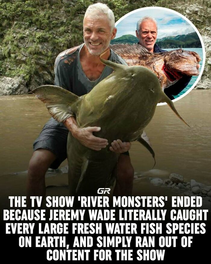 Man holding a giant freshwater fish beside a river, illustrating one of 80 interesting facts about capturing rare species.