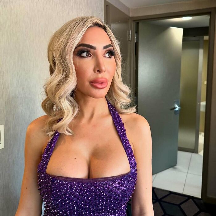 Blonde woman in a purple dress posing indoors, related to celebrity encounters that went well or terribly bad.