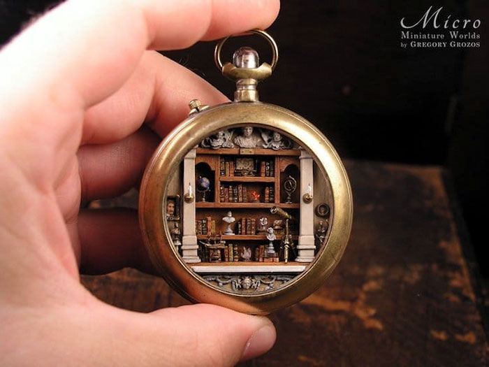 Hand holding a pocket watch displaying an intricate miniature library inside, showcasing secret worlds.