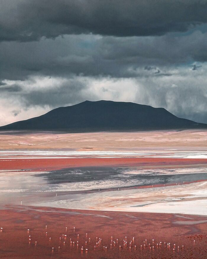 Drone photograph by Dimitar Karanikolov depicting a dramatic landscape with mountains and colorful terrain.