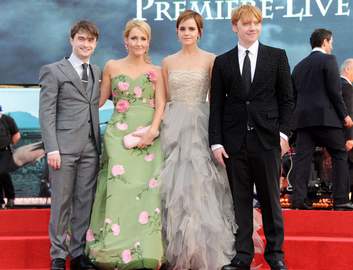 Harry Potter stars with author on red carpet, related to JK Rowling defense backlash. Harry Potter stars with author on red carpet, related to JK Rowling defense backlash.