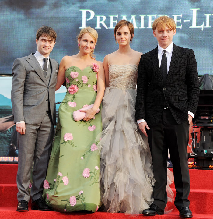 Harry Potter cast at a premiere event, posing on the red carpet in formal attire.