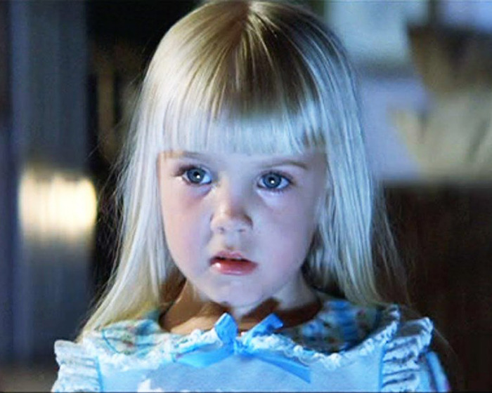 Young child actor with blonde hair and bright eyes, representing those who tragically passed away at a young age.