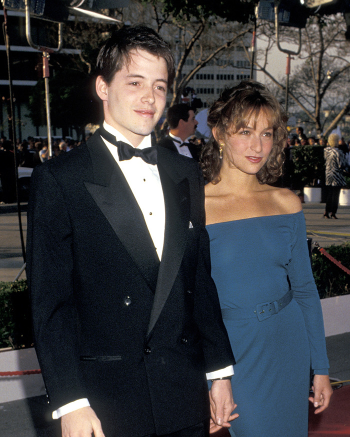 A couple in formal attire at a Hollywood event, representing forgotten scandals from the industry.