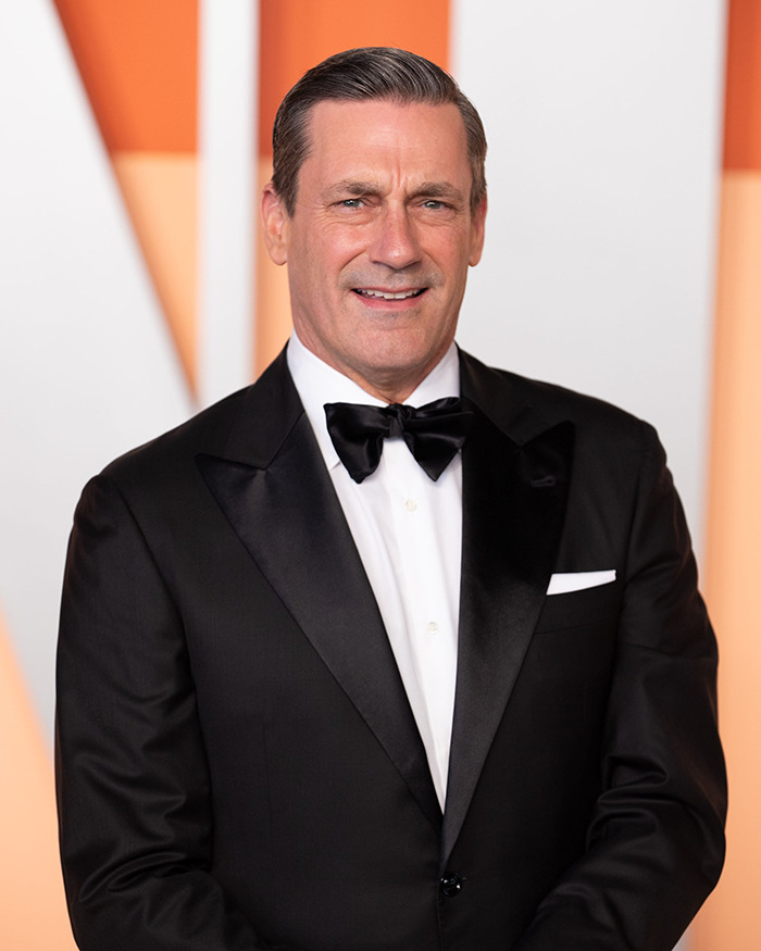 "Man in a tuxedo at a formal event, evoking classic Hollywood elegance and style."