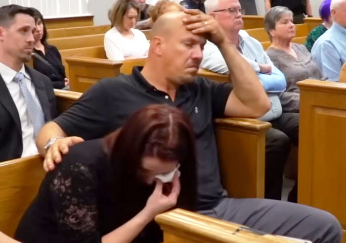 Courtroom scene with emotional attendees, related to a grandma's sentencing for an infant left in a hot car. Courtroom scene with emotional attendees, related to a grandma's sentencing for an infant left in a hot car.