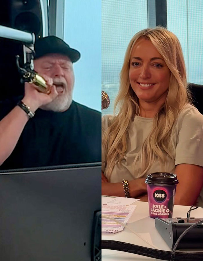 Radio hosts in studio, one wearing a hat singing into a microphone, the other smiling with a coffee cup nearby. Radio hosts in studio, one wearing a hat singing into a microphone, the other smiling with a coffee cup nearby.