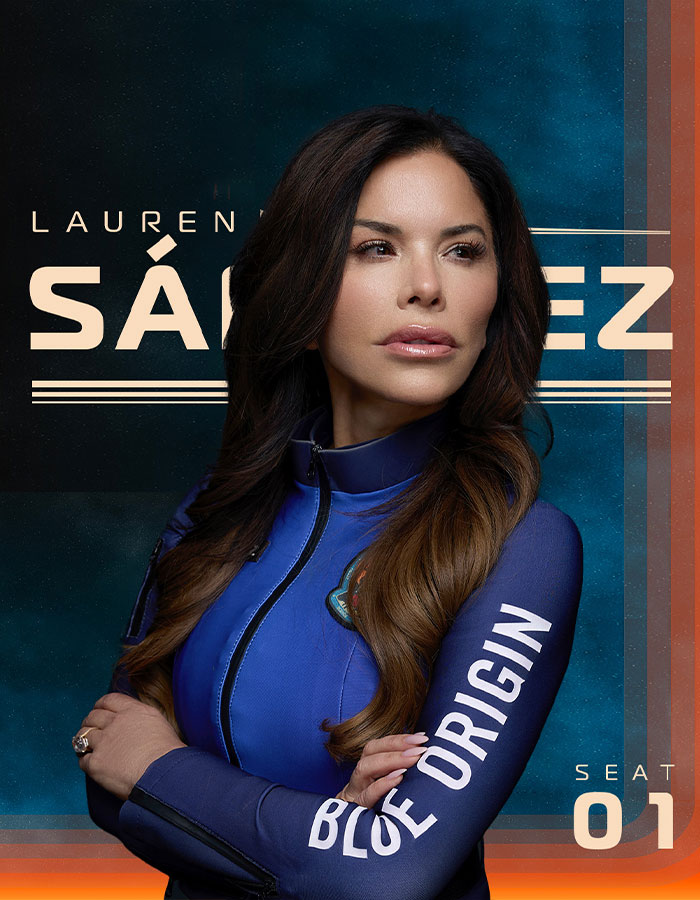 Lauren in Blue Origin suit, contemplating effects of filler during space mission.