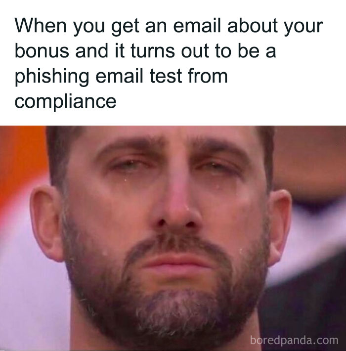 Man looking disappointed after receiving a phishing test email at work, capturing the struggle of many employees.