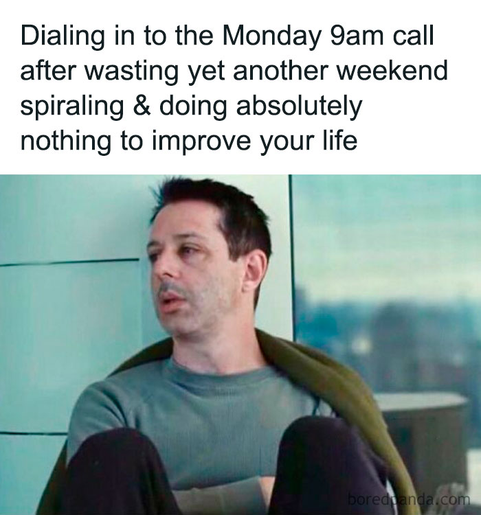 Tired employee in a gray shirt, slouched in a chair, reflects Monday morning work struggles with a resigned expression.