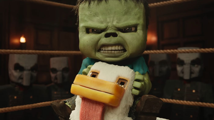 A green zombie-like character from the Minecraft Movie rides a duck, contributing to a controversial cinema trend.