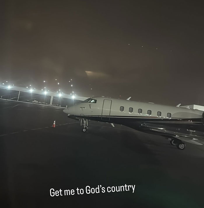 Private jet at night on tarmac, captioned "Get me to God&rsquo;s country," hinting at a petulant move.