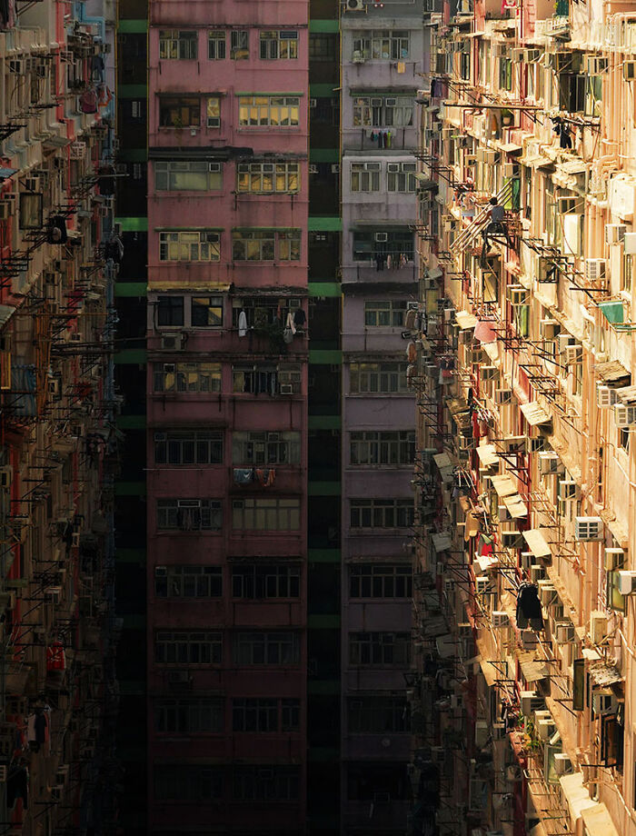 On The Canyon's Edge, 2024 - A Worker Is Grabbing The Metallic Frame That Will Serve As The Base Of The Bamboo Scaffolding To Be Built